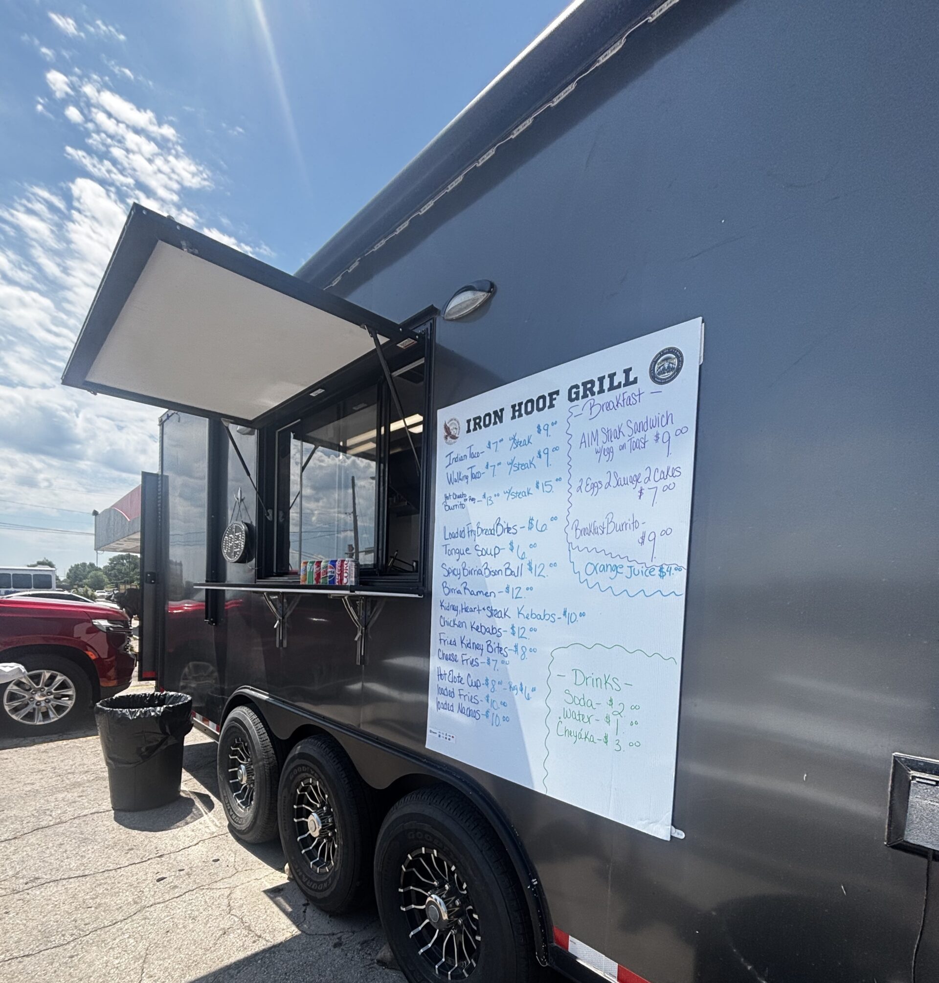 black iron hoof grill food truck with menu of items